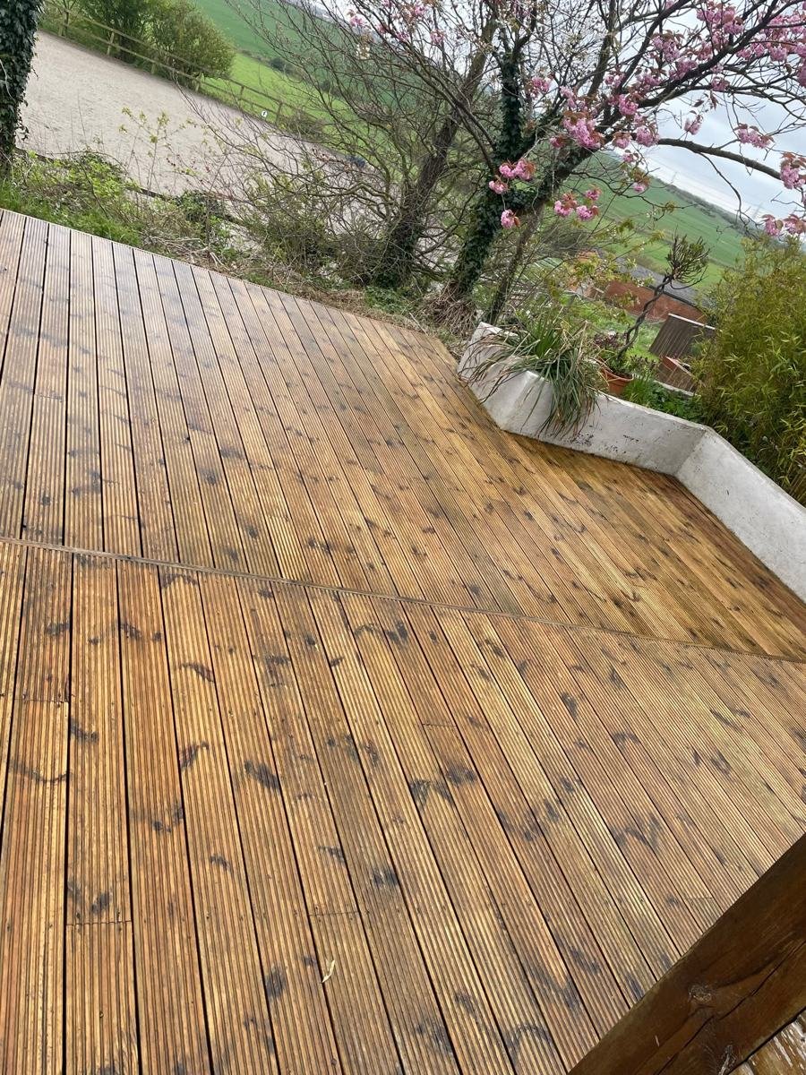 Clean garden path and paving beside a family home