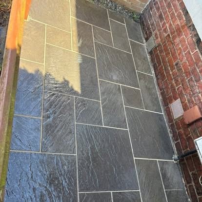 Grey slate-effect patio slabs after jet washing