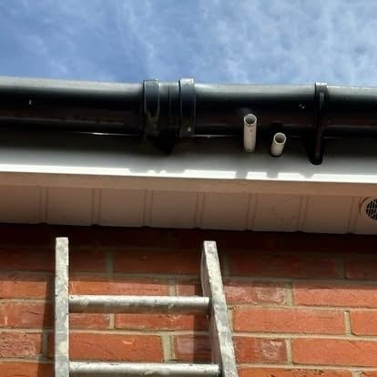 Gutter and downpipe cleared of debris