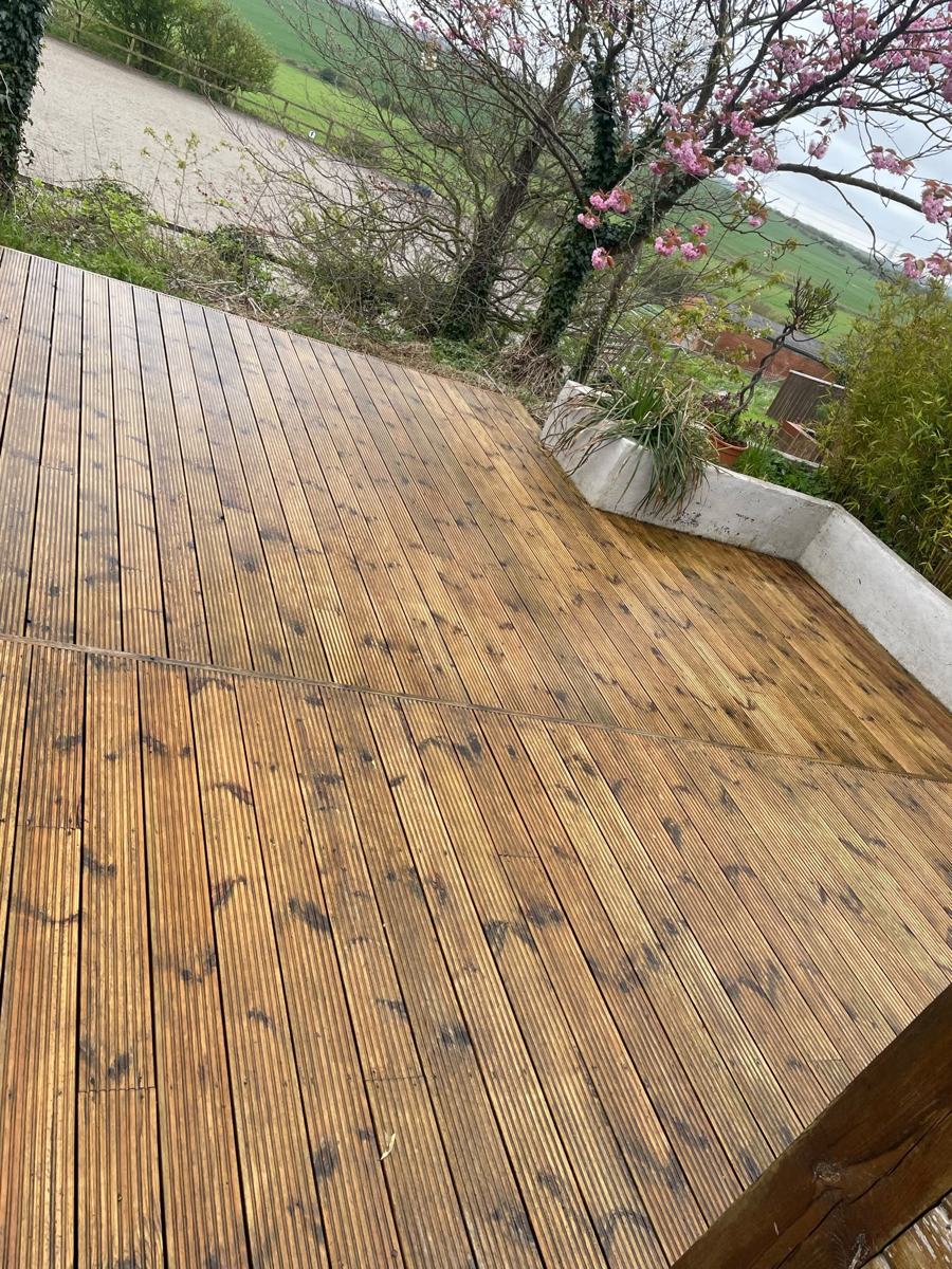 Clean garden path and paving beside a family home