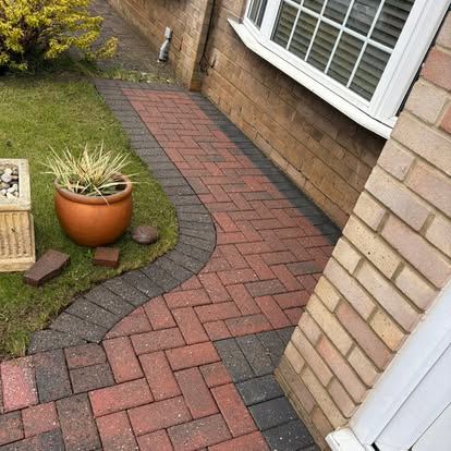 Neatly cleaned garden path leading to a family home